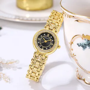 Detail of elegant gold women's watch featuring a crystal bezel and black shell dial