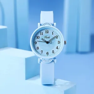 Detailed view of sky blue women watch with Arabic numerals and heart-shaped second hand