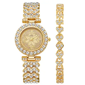 Women's gold watch and heart bracelet set with sparkling crystals and floral dial
