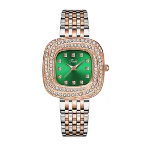 Elegant women's quartz watch with green dial, diamond bezel, and two-tone steel strap