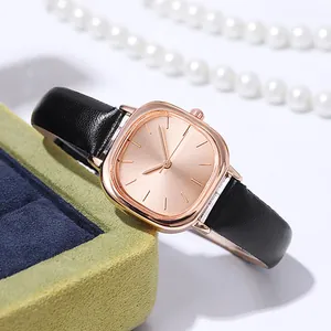 Elegant women's square rose gold watch with black leather strap and textured dial