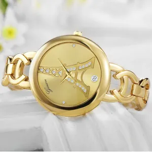 Montre dorée pour femme avec cadran Tour Eiffel et strass sur un bracelet à maillons