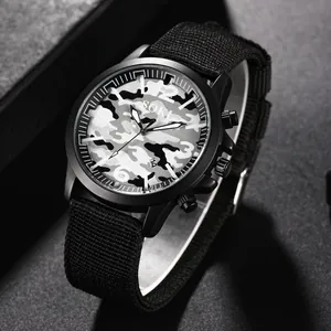 Detail of SOKI tactical watch with camo dial, black nylon strap and date window display