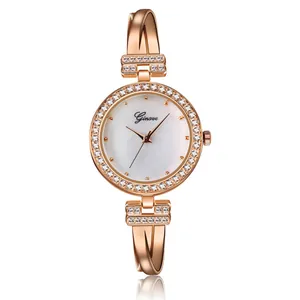Detail view of rose gold women bracelet watch with pearl dial and sparkling crystals