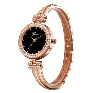 Detail shot of rose gold fashion watch with black dial and crystal encrusted bezel