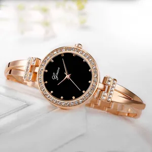 Detailed view of rose gold quartz bangle watch with crystal-encrusted bezel and black dial