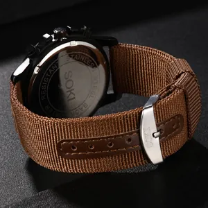 Macro shot of SOKI S-1015 watch back with stainless steel case and brown nylon strap