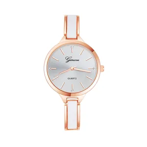 Detailed macro view of the rose gold bezel and white ceramic bracelet links of this watch