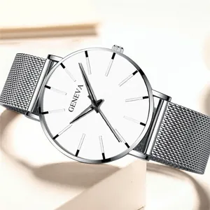 Macro side view of silver mesh band and minimalist Geneva watch dial with silver markers