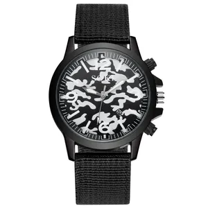 Detailed close-up of the black camouflage dial and date window on SOKI military quartz watch