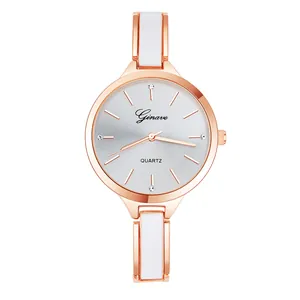 Detail of rose gold quartz watch with white enamel bracelet and rhinestone indices