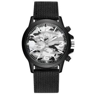 Detailed macro view of SOKI quartz watch face with camo pattern and luminous numerals