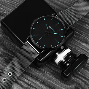 Close-up of Geneva quartz watch with blue markers and silver Milanese mesh strap