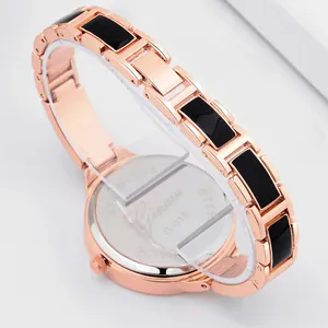 Ginave women's quartz watch in rose gold with black link strap on display stand