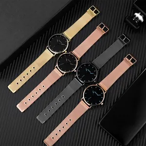 Detail of Geneva quartz watches with Milanese mesh bands in gold, rose gold and grey