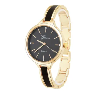 Detail of the black dial and gold strap with black enamel inlays on a ladies quartz watch