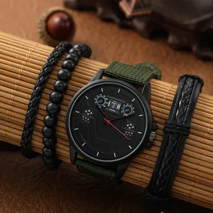 Dettaglio orologio da uomo con cinturino in nylon verde e tre bracciali neri intrecciati