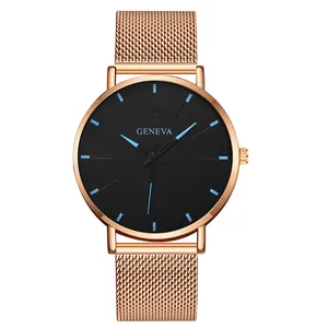 Close-up of Geneva rose gold mesh watch strap and dark black dial with blue markers
