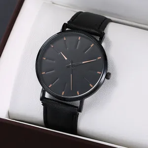 Minimalist black alloy watch with rose gold markers and leather strap in a gift box