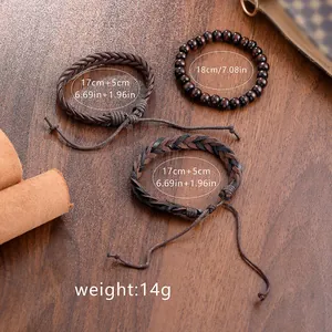 Three-piece set of woven canvas and wood bead bracelets on a dark wood background