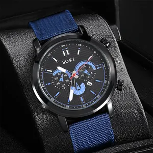 Close-up of SOKI sports watch with black alloy dial and blue nylon canvas strap