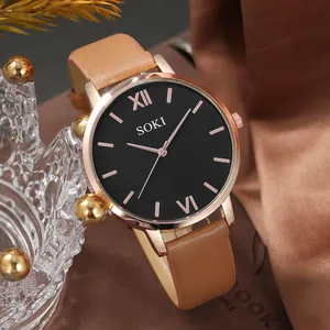 Montre quartz élégante or rose avec bracelet en cuir marron et cadran noir chic