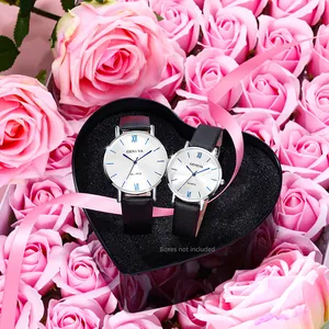 Elegant pair of Geneva quartz watches with silver cases and black leather straps in a gift box