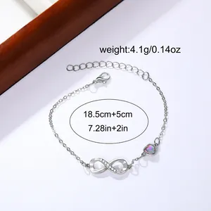 Silver infinity bracelet with iridescent heart charm and adjustable lobster clasp