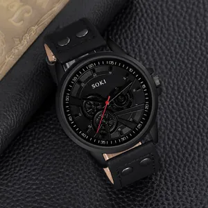 Detail of SOKI black military quartz watch with studded leather strap on vintage background