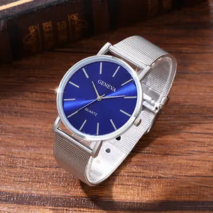 Macro shot of Geneva quartz watch featuring blue sunray dial and silver mesh strap