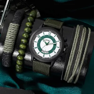 Close-up of SOKI quartz watch with green canvas strap and three braided bracelets set