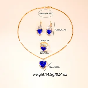 Elegant gold-tone jewelry set with blue heart crystals including necklace, earrings and ring