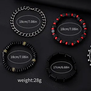 Detail view of four-piece men's bracelet set with black metal chains and beaded textures