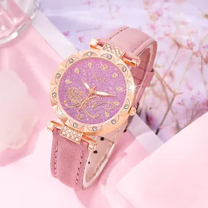 Detail of pink glitter dial watch with rose gold bezel and crystal accents