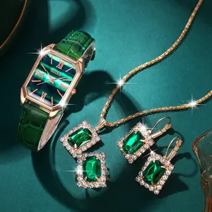 Elegant rose gold women's watch set with emerald gemstone necklace, ring and earrings