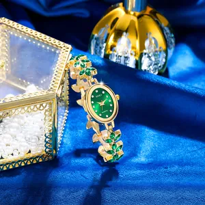 Luxurious SOKI green dial quartz watch with golden leaf-shaped metal strap for women