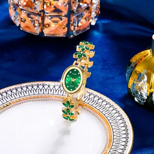 Luxury gold quartz watch for women with green sunray dial and gemstone leaf bracelet