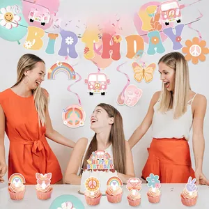 Three happy women celebrating birthday with groovy 70s theme banner and daisy decorations