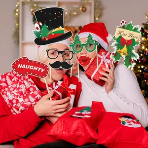 Christmas party photo booth props kit with Santa hats, glasses and naughty signs