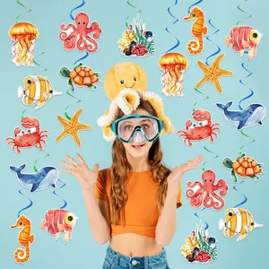 Ocean theme party decorations with colorful sea animal hanging swirls and paper cutouts