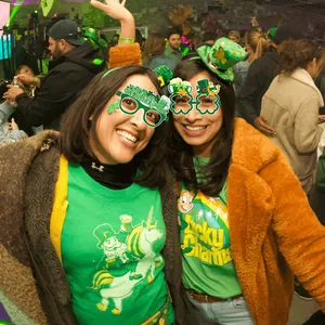 Festive St. Patrick's Day party glasses with green clover and beer mug designs