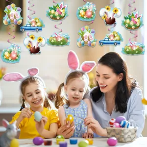 Easter party hanging swirl decorations with bunnies and eggs above a family crafting scene