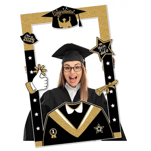 Detail of 2025 graduation photo frame prop with gold glitter patterns and diploma icons