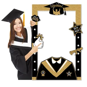 Detail of 2025 graduation photo booth prop frame with black and gold glitter accents