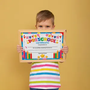 Detailed view of Preschool graduation certificate in wood frame with colorful pencil graphics