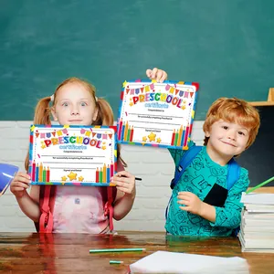 Preschool graduation certificate with colorful cartoons shown on a classroom desk