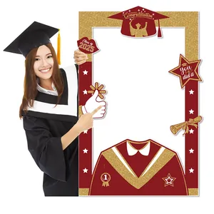 Close-up of Class of 2025 graduation photo frame prop with gold glitter decorations