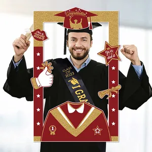 Close-up of a 2025 graduation photo frame prop with black, gold and red accents
