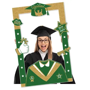 Detail of Class of 2025 graduation photo frame prop in forest green and gold glitter finish