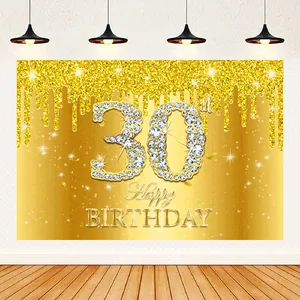 Detailed view of golden 30th birthday backdrop with sparkling glitter and diamond effects